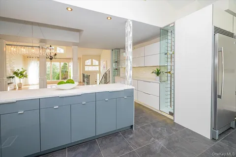 a spacious bathroom with a double vanity sink a mirror and a shower