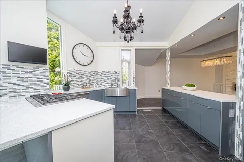 a kitchen with sink cabinets and window