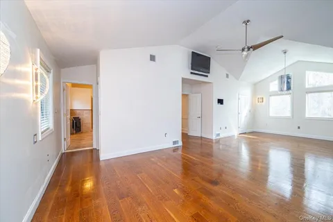 a view of a livingroom with wooden floor