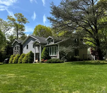 an aerial view of houses with yard