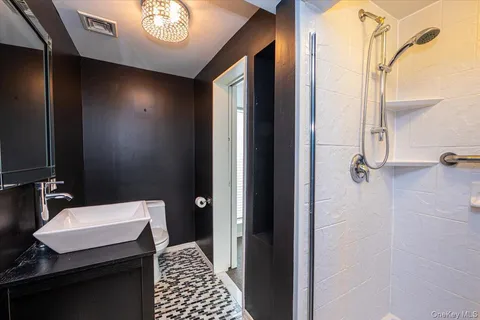 a bathroom with a sink and a mirror