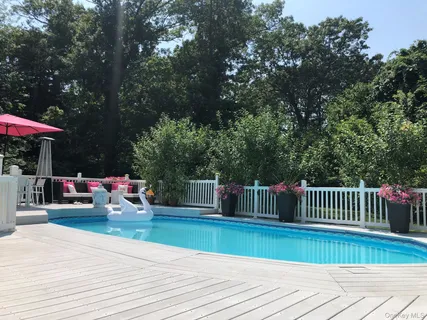 a view of house with patio and deck