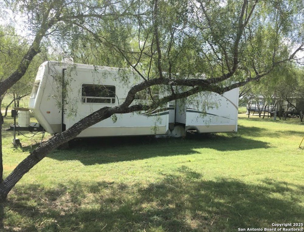 1197 FM 2443 Road Kenedy, TX 78119 - Photo 15 of 18 a house view with a swimming pool