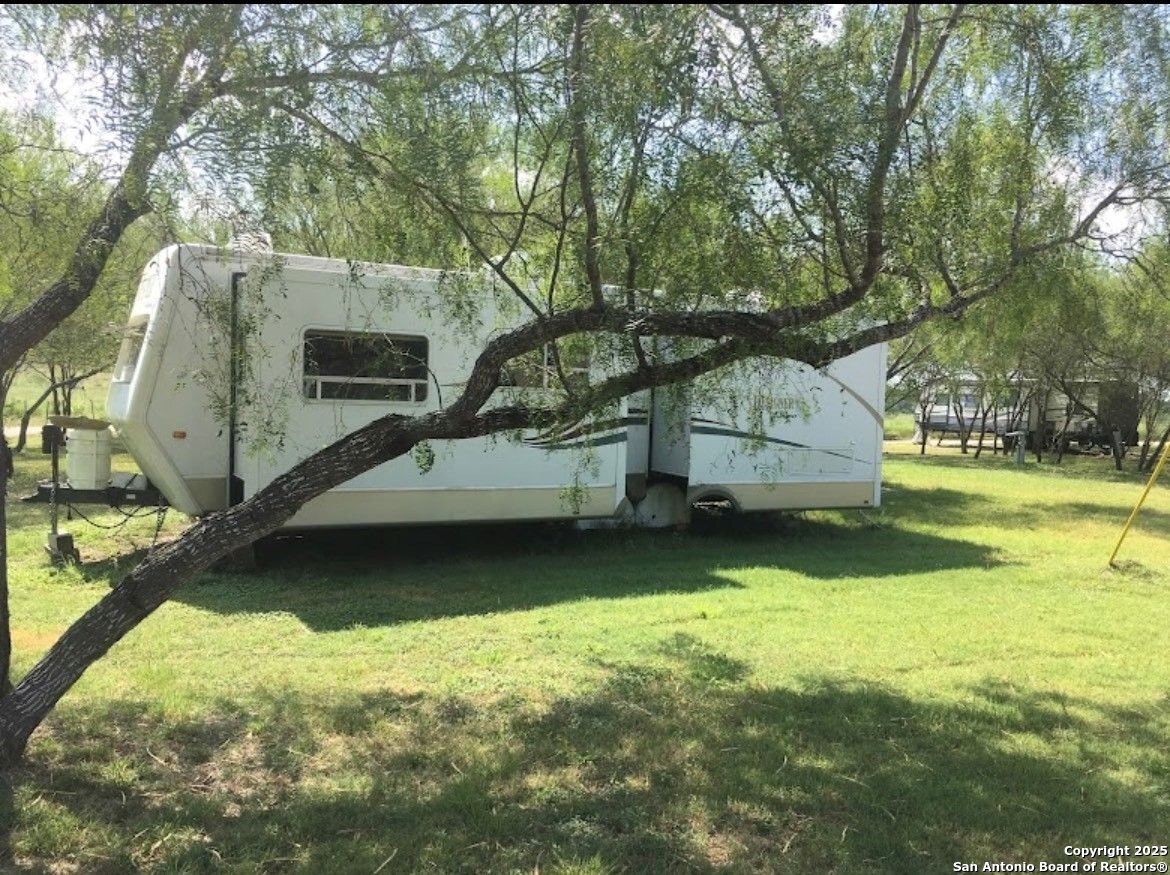 1197 FM 2443 Road Kenedy, TX 78119 - Photo 4 of 18 a view of a two chairs in the patio