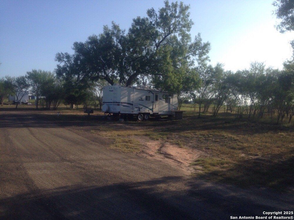 1197 FM 2443 Road Kenedy, TX 78119 - Photo 9 of 18 a view of a yard