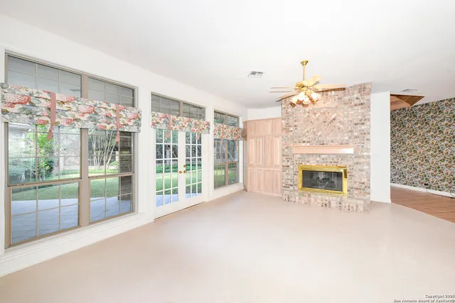 a view of livingroom with furniture fire place and flat screen tv