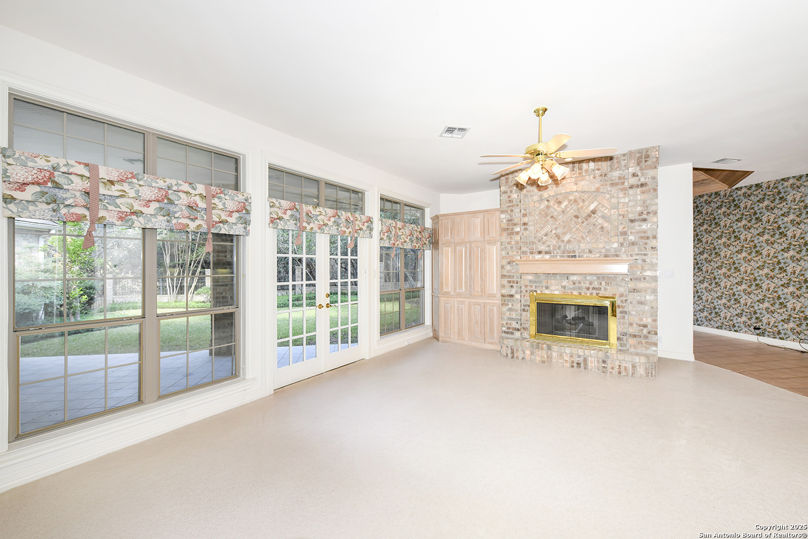 13 Westelm Circle San Antonio, TX 78230 - Photo 11 of 46 a view of livingroom with furniture fire place and flat screen tv