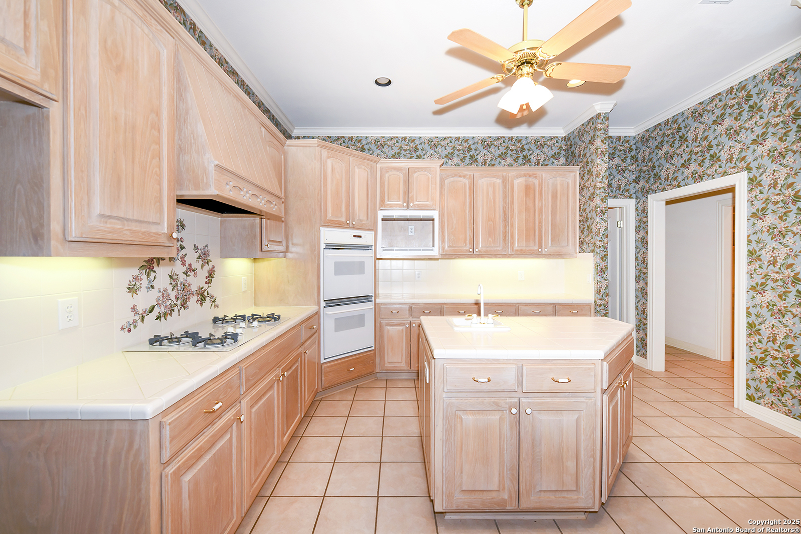 13 Westelm Circle San Antonio, TX 78230 - Photo 15 of 46 a kitchen with stainless steel appliances kitchen island granite countertop a sink a stove a dining table and chairs