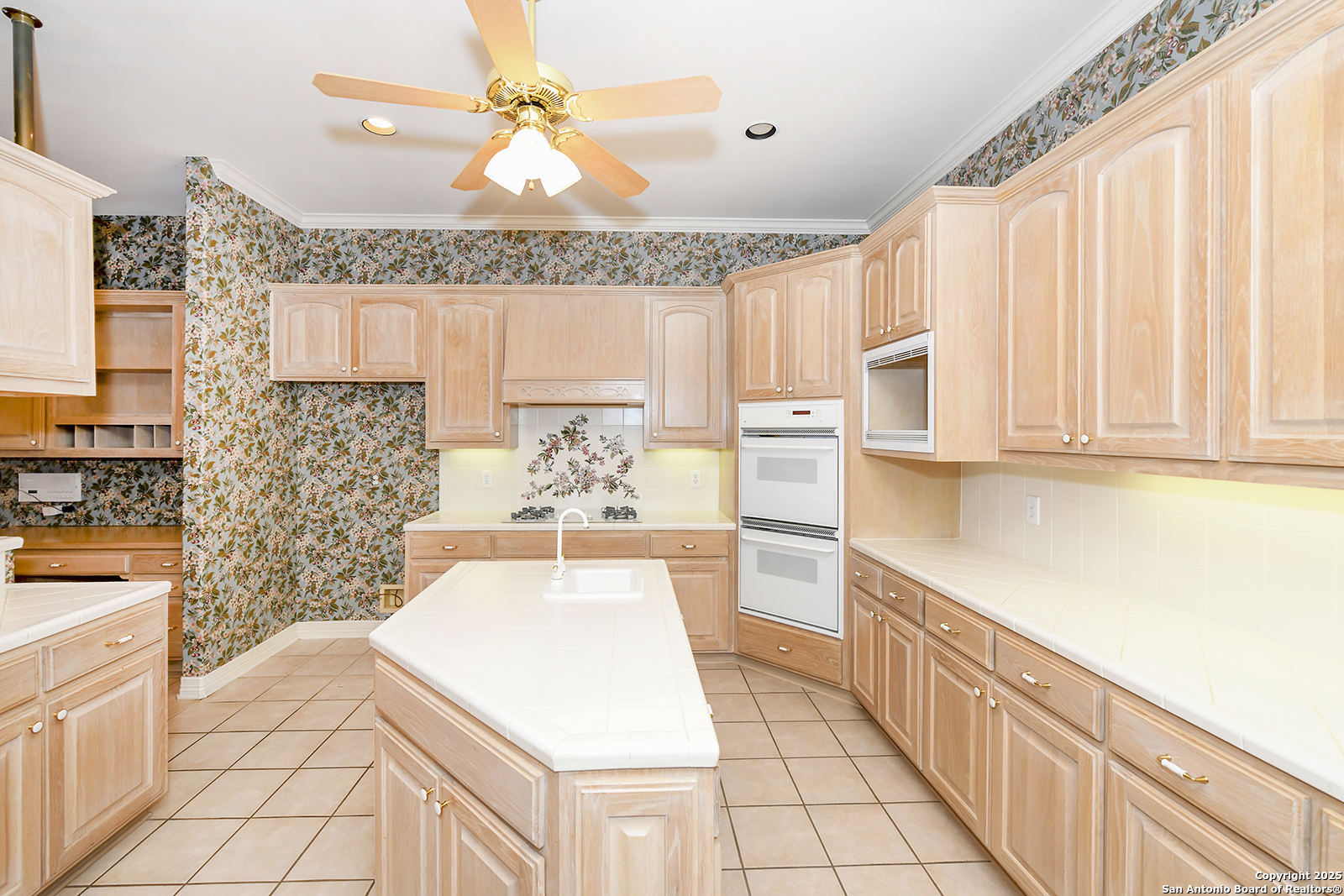 13 Westelm Circle San Antonio, TX 78230 - Photo 16 of 46 a kitchen with stainless steel appliances a stove a sink and a microwave