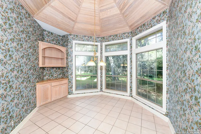 a view of a room with a large window