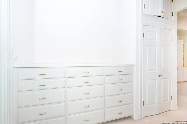 a view of an empty walk in closet