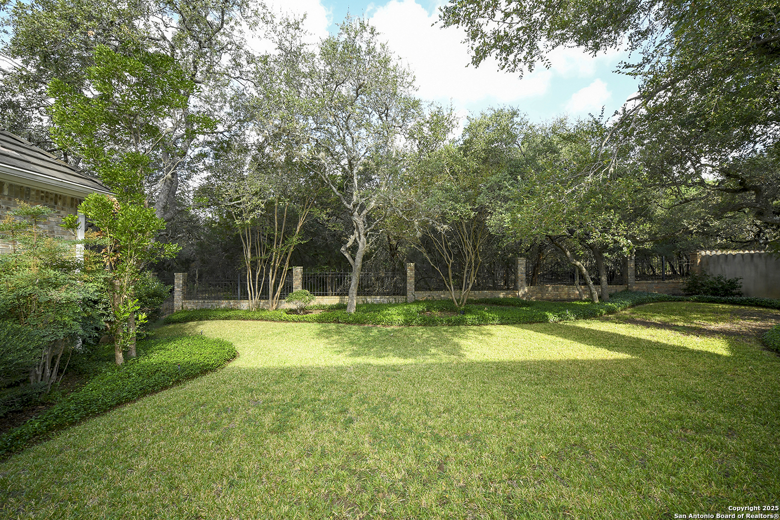 13 Westelm Circle San Antonio, TX 78230 - Photo 37 of 46 a view of a backyard with a garden and trees