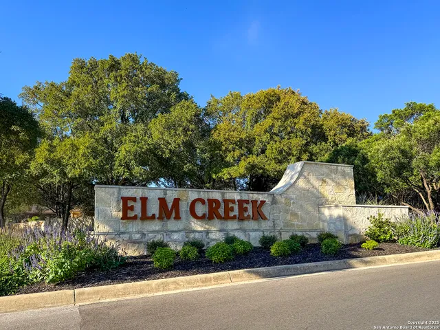 a front view of house with a garden