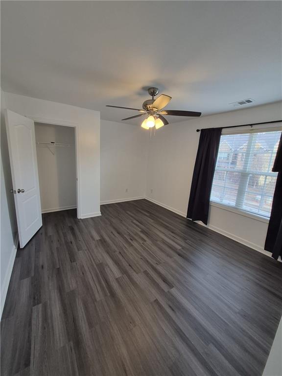 2689 Muskeg Court Southwest Atlanta, GA 30331 - Photo 14 of 35 a view of an empty room with wooden floor and a window