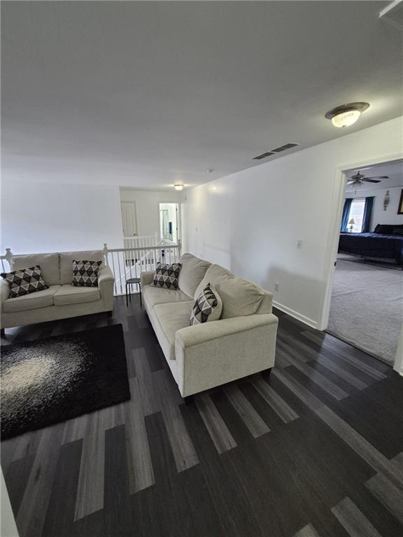 2689 Muskeg Court Southwest Atlanta, GA 30331 - Photo 16 of 35 a living room with furniture and a kitchen view