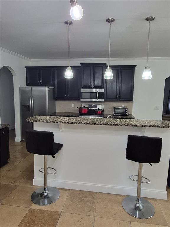 2689 Muskeg Court Southwest Atlanta, GA 30331 - Photo 31 of 35 a kitchen with kitchen island granite countertop a counter space a sink appliances and cabinets