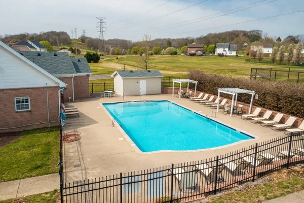 a view of a swimming pool with a lake view