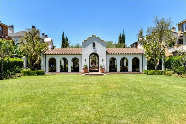 a large white house with a white fence in front of it