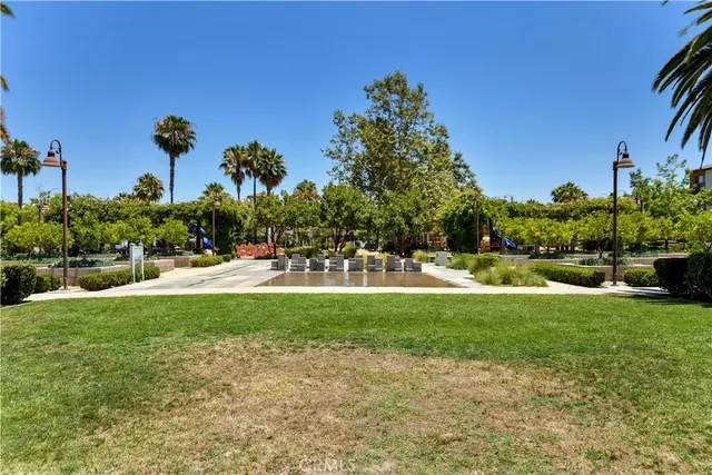 a garden view with a fountain