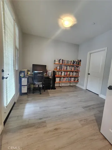a view of a livingroom with furniture and a window