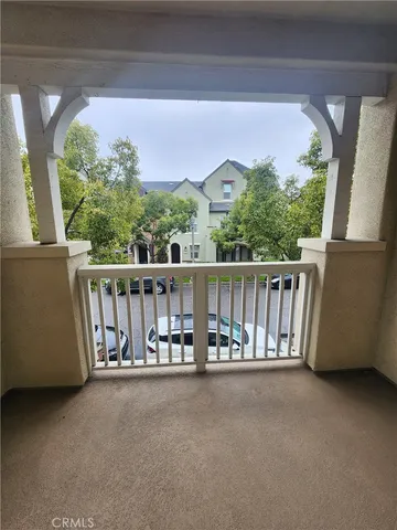 a view of roof deck with furniture