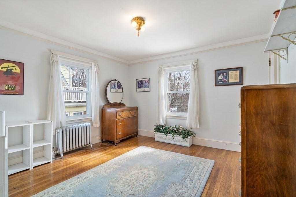 129 Standish Road Watertown, MA 02472 - Photo 11 of 17 a room with furniture and wooden floor