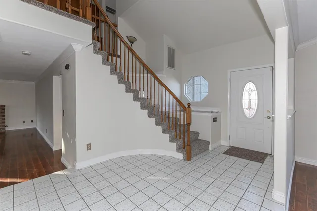 a view of entryway and hall with a front door