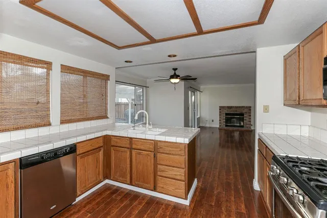 a kitchen with a sink stove and cabinets