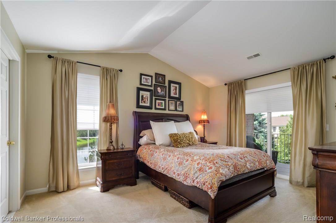 1940 Flagstone Circle, Unit 95 Rochester, MI 48307 - Photo 14 of 33 014-Master_Bedroom-4271017-large.jpg