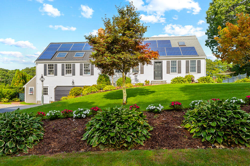 359 Cap'n Lijah's Road Centerville, MA 02632 - Photo 3 of 43 a front view of a house with a garden