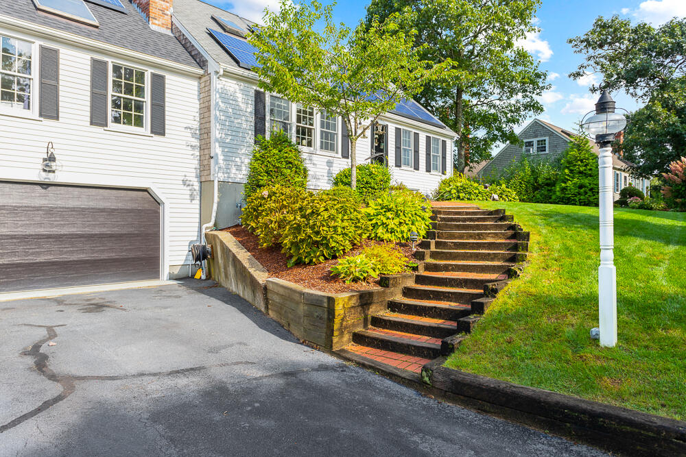 359 Cap'n Lijah's Road Centerville, MA 02632 - Photo 6 of 43 a front view of a house with a yard
