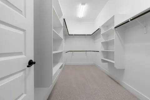 a view of an empty walk in closet