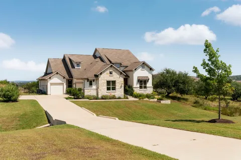 a view of multiple houses with a yard
