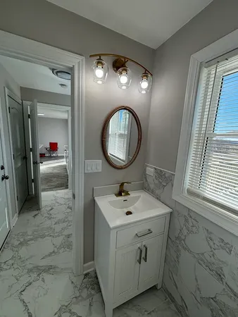 a bathroom with a toilet sink and shower