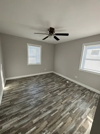 a room with lots of furniture and a lamp