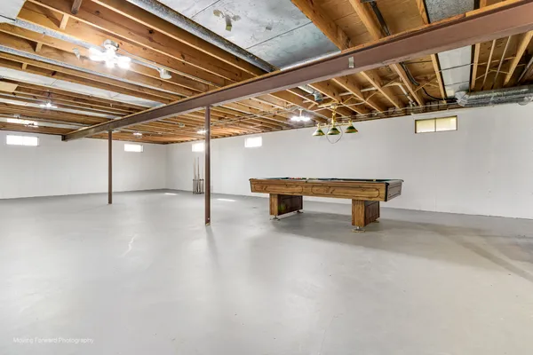 a room with wooden furniture and windows