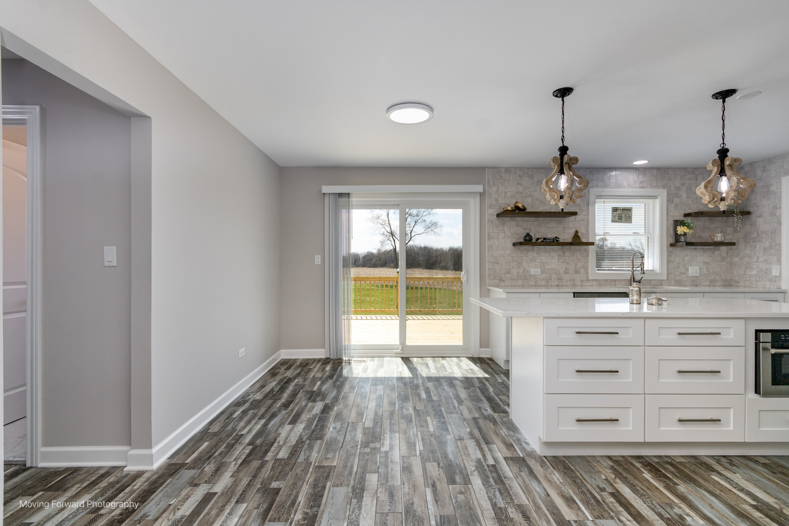 38W715 Huntley Road West Dundee, IL 60118 - Photo 27 of 42 a open kitchen with white cabinets and wooden floor