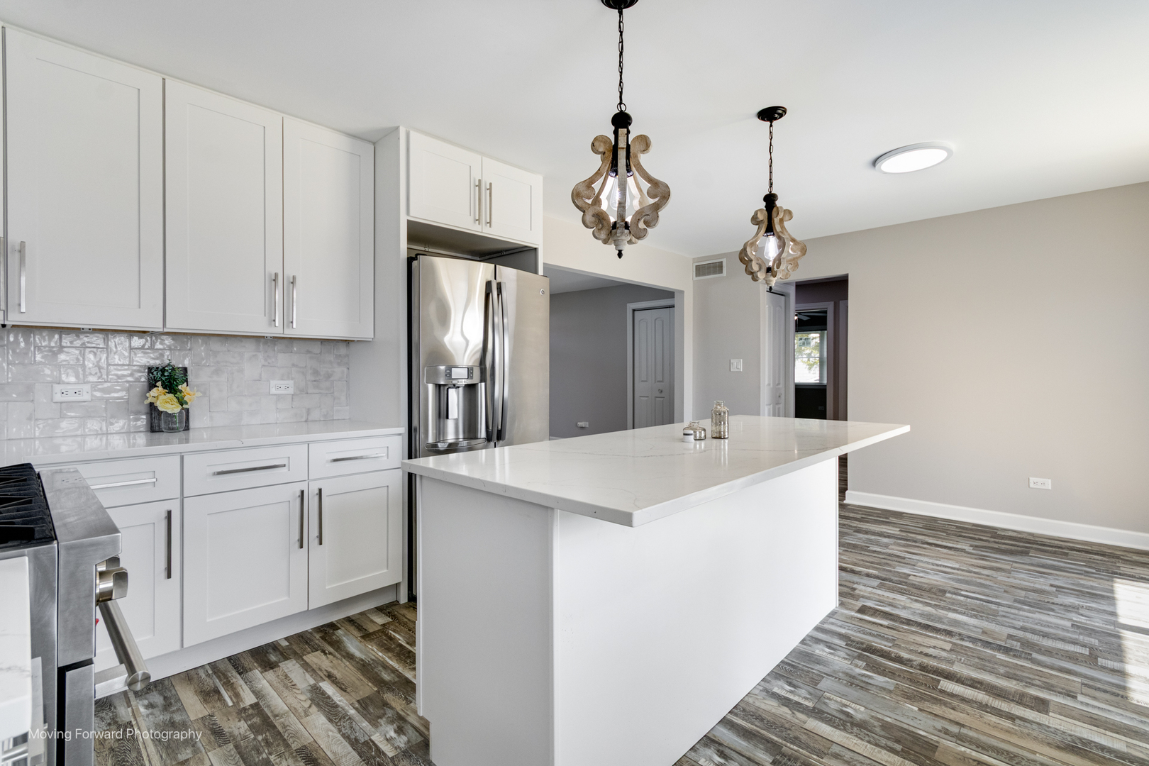 38W715 Huntley Road West Dundee, IL 60118 - Photo 32 of 42 a view of a kitchen counter space a sink stainless steel appliances and cabinets