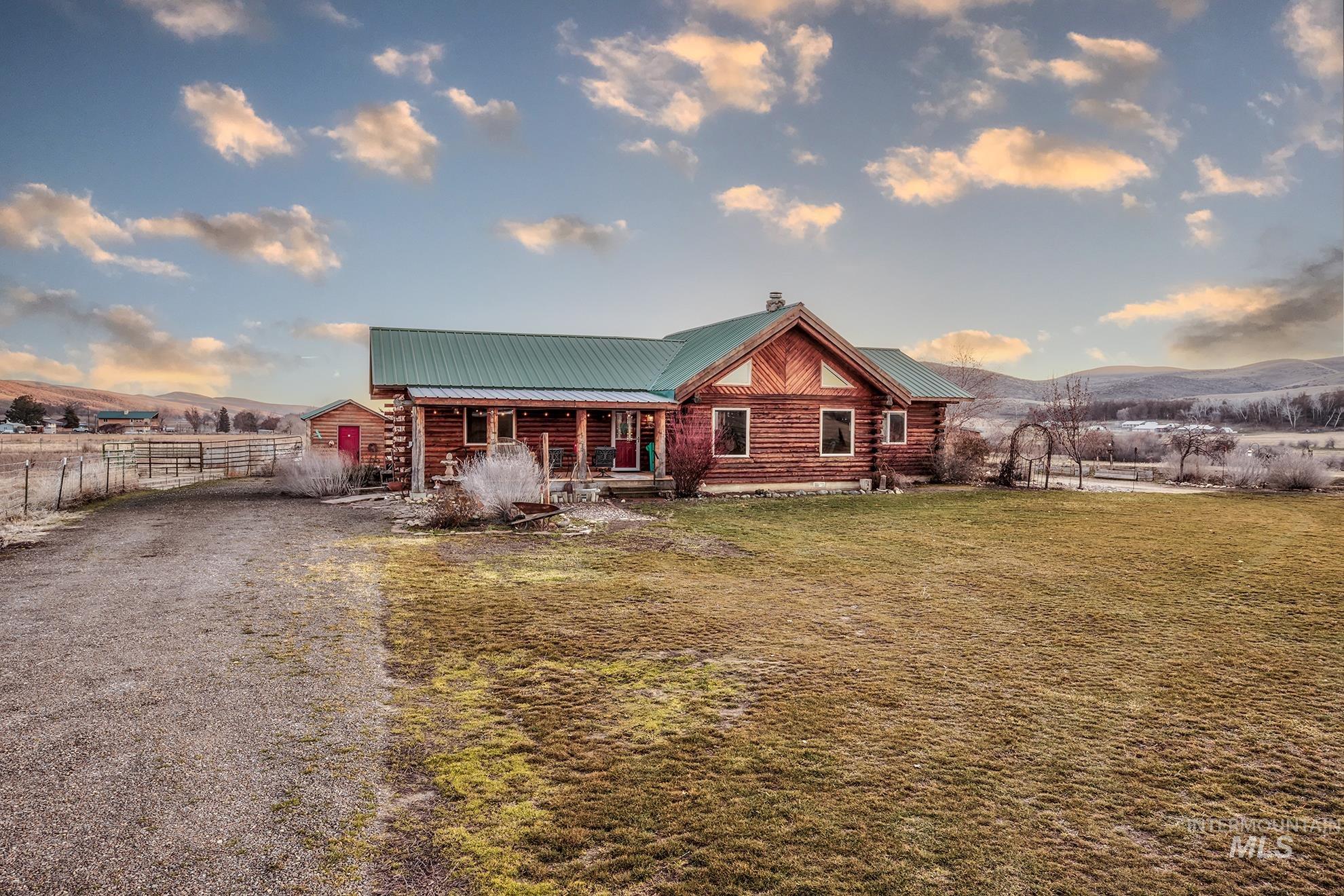 1855 Jones Road Weiser, ID 83672 - Photo 34 of 34 Log cabin architecture with a green metal roof