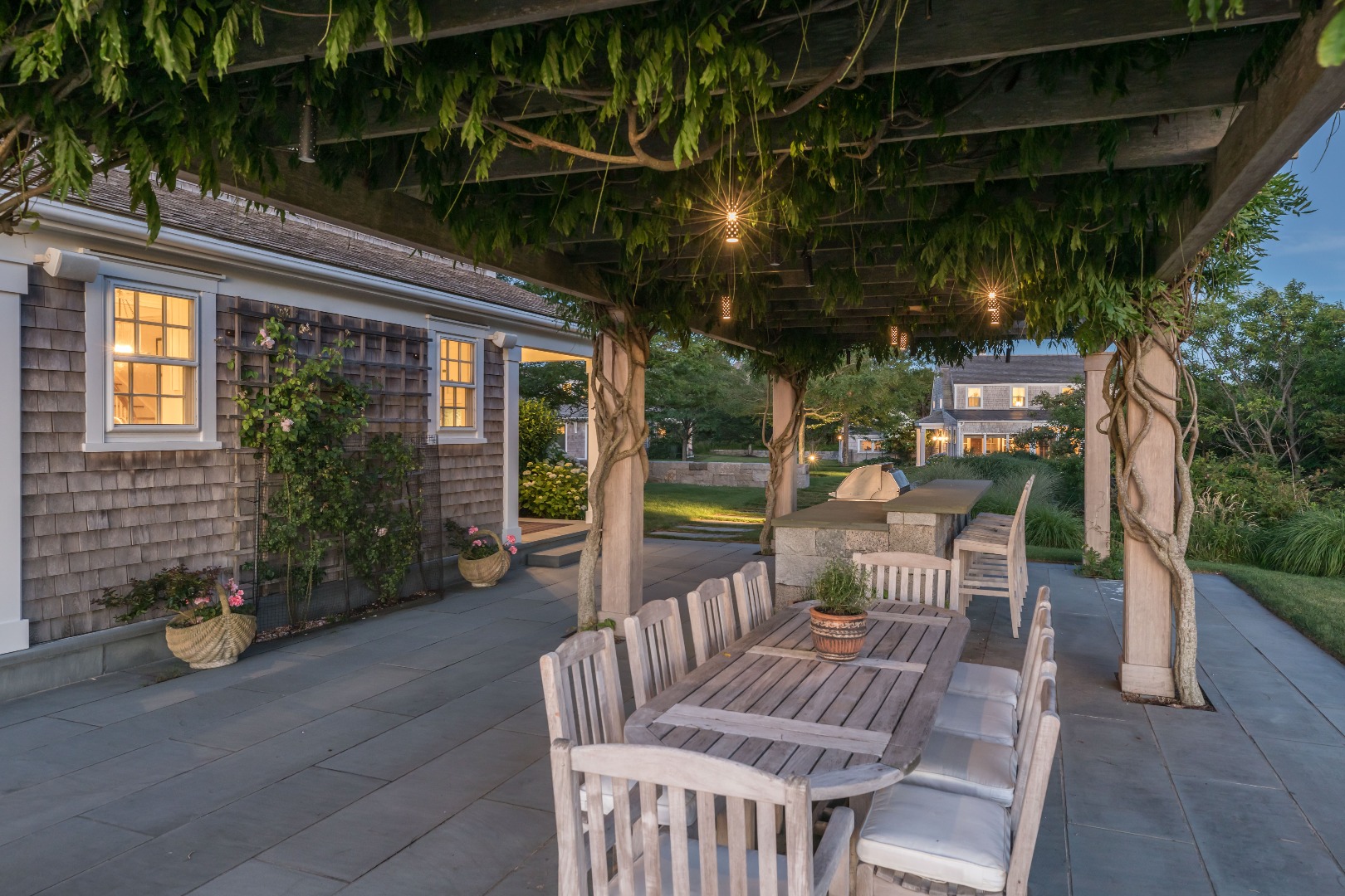 20 Berkeley Avenue Nantucket, MA 02554 - Photo 16 of 30 a view of a chairs and table in a patio