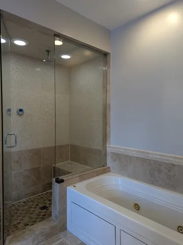 a bathroom with a shower and a sink