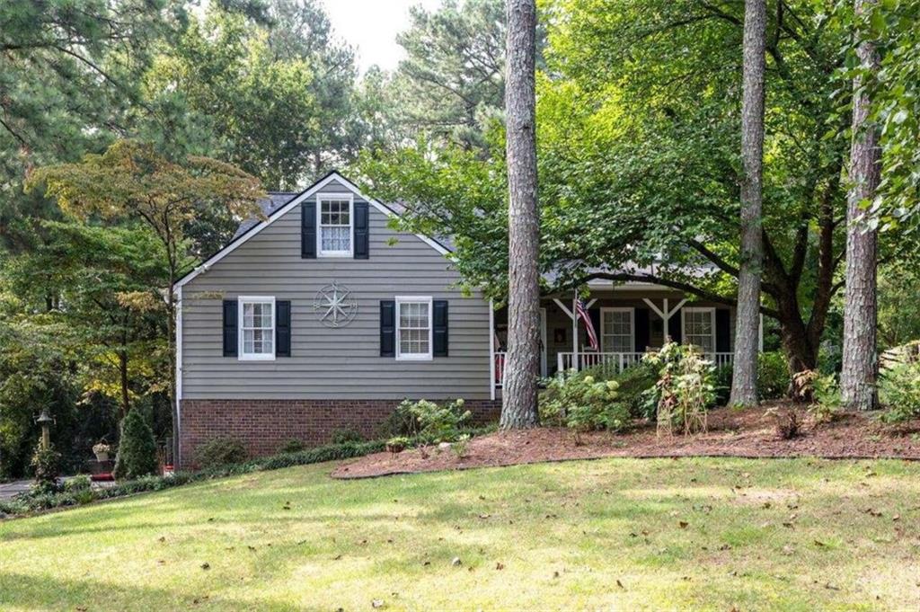 a front view of a house with garden