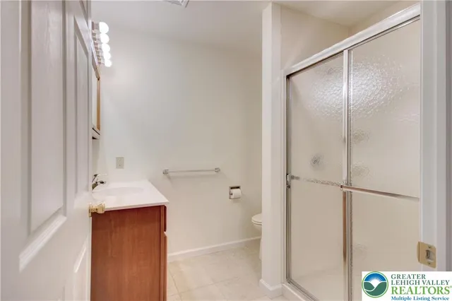 a bathroom with a shower and a sink