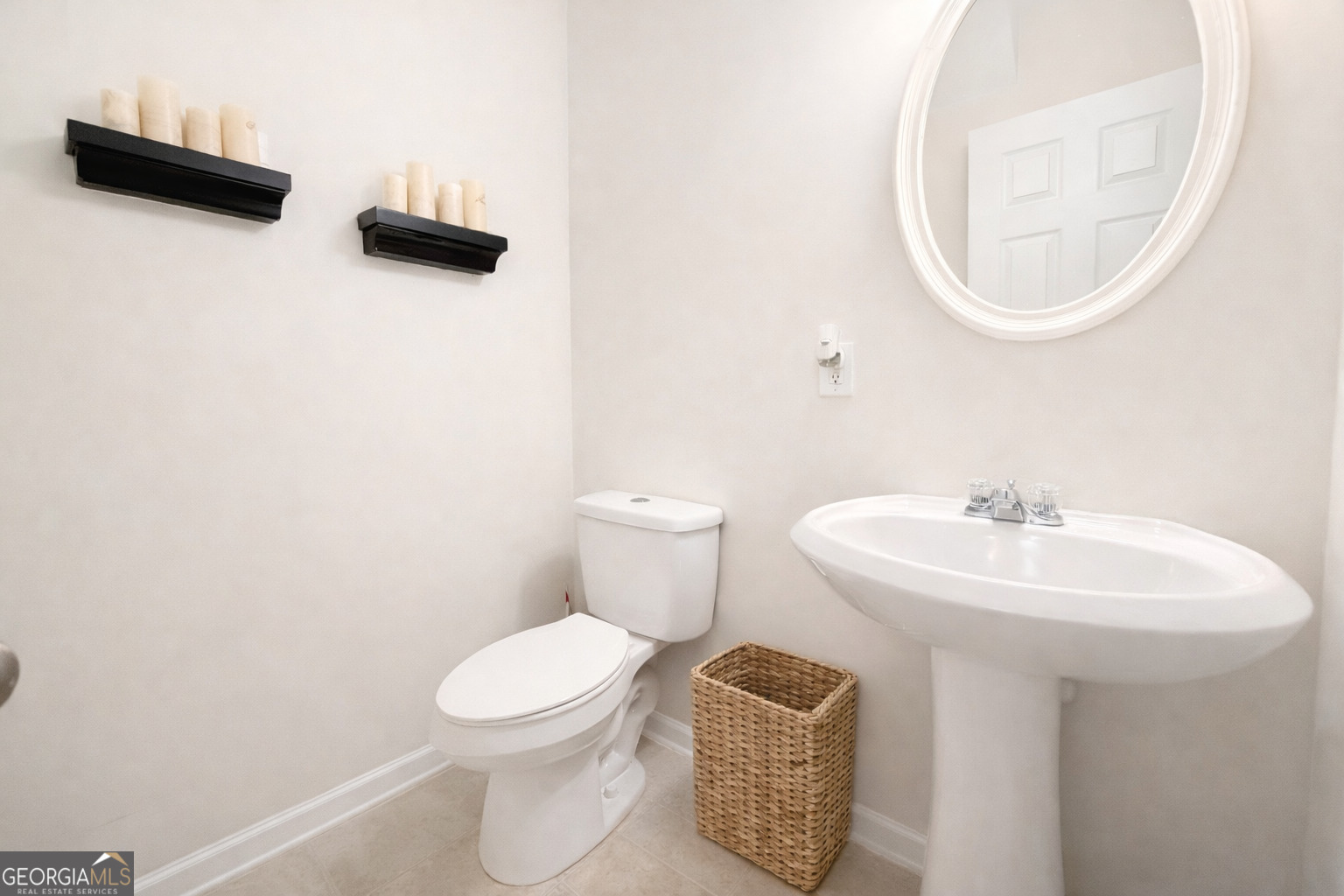 141 C3 Mill Carrollton, GA 30116 - Photo 12 of 27 a bathroom with a toilet a sink and mirror
