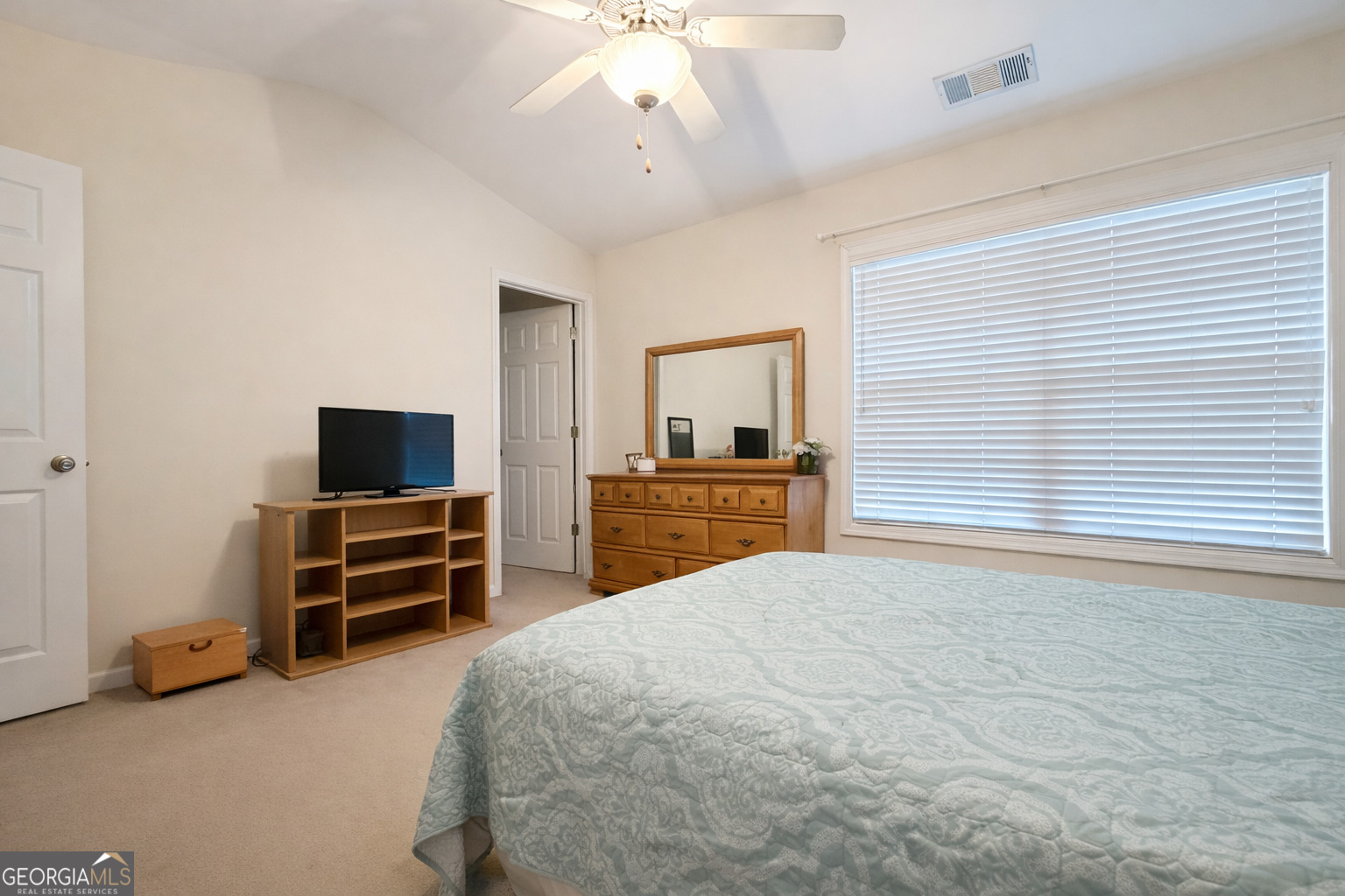 141 C3 Mill Carrollton, GA 30116 - Photo 13 of 27 a bedroom with a bed and a flat screen tv