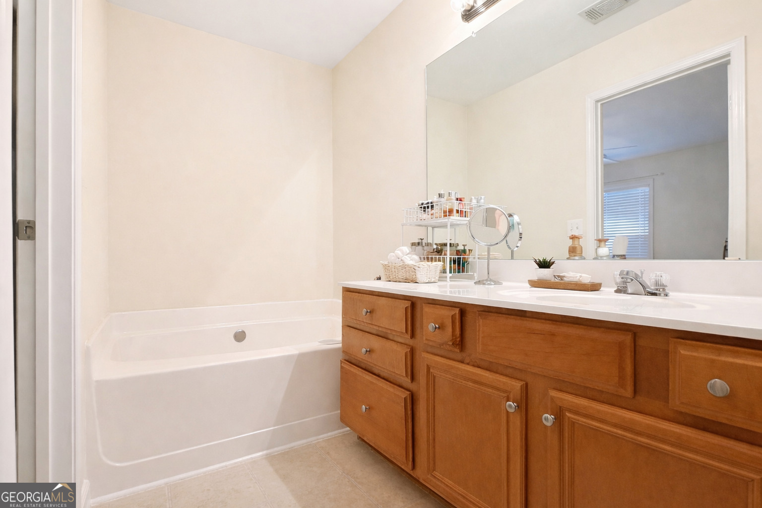 141 C3 Mill Carrollton, GA 30116 - Photo 16 of 27 a bathroom with a tub sink and mirror
