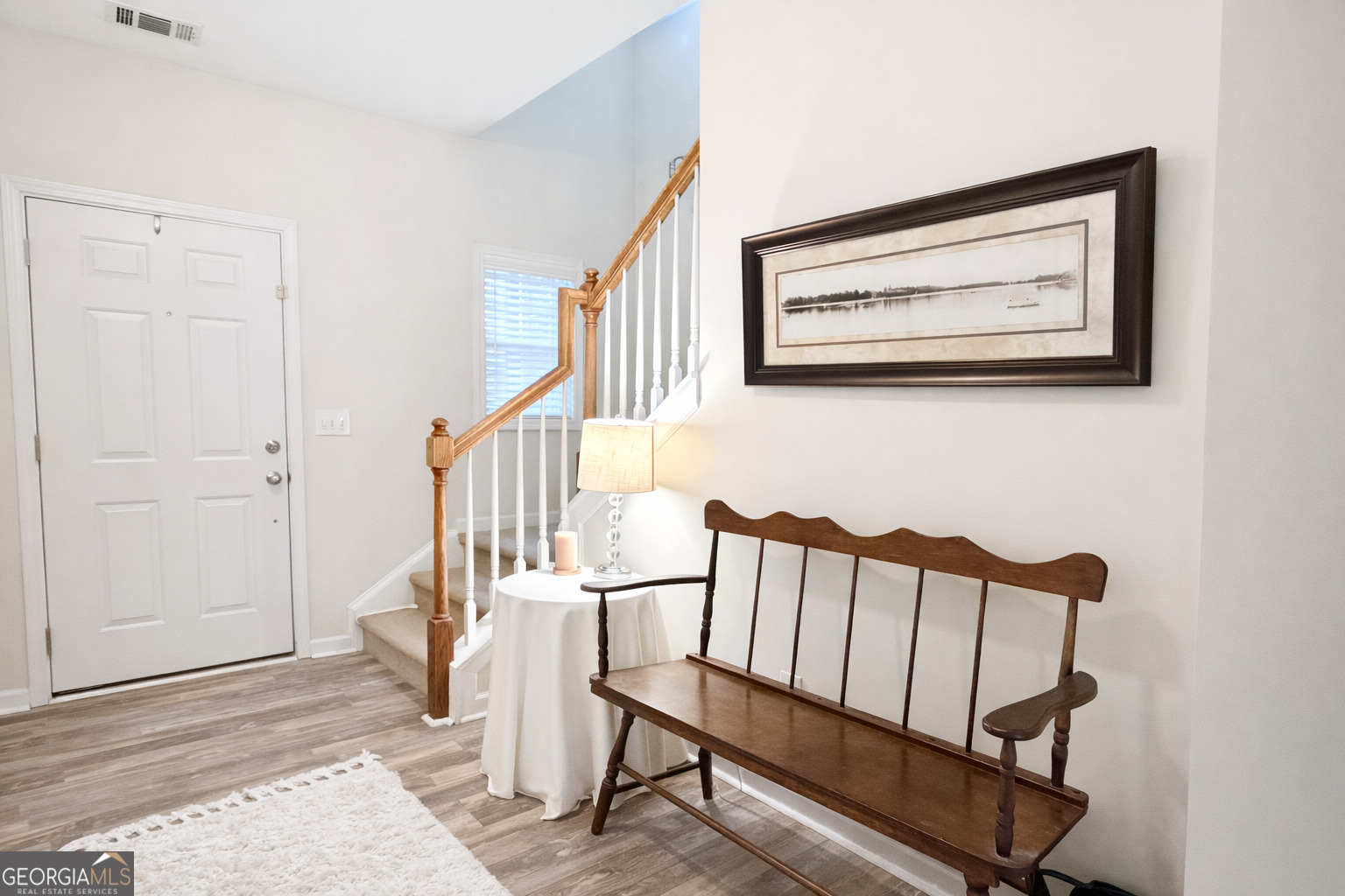 141 C3 Mill Carrollton, GA 30116 - Photo 4 of 27 a view of entryway with wooden floor and stairs