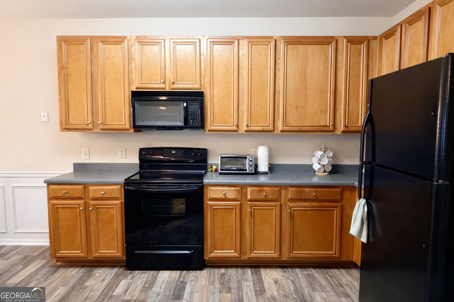 141 C3 Mill Carrollton, GA 30116 - Photo 7 of 27 a kitchen with granite countertop a refrigerator stove and sink