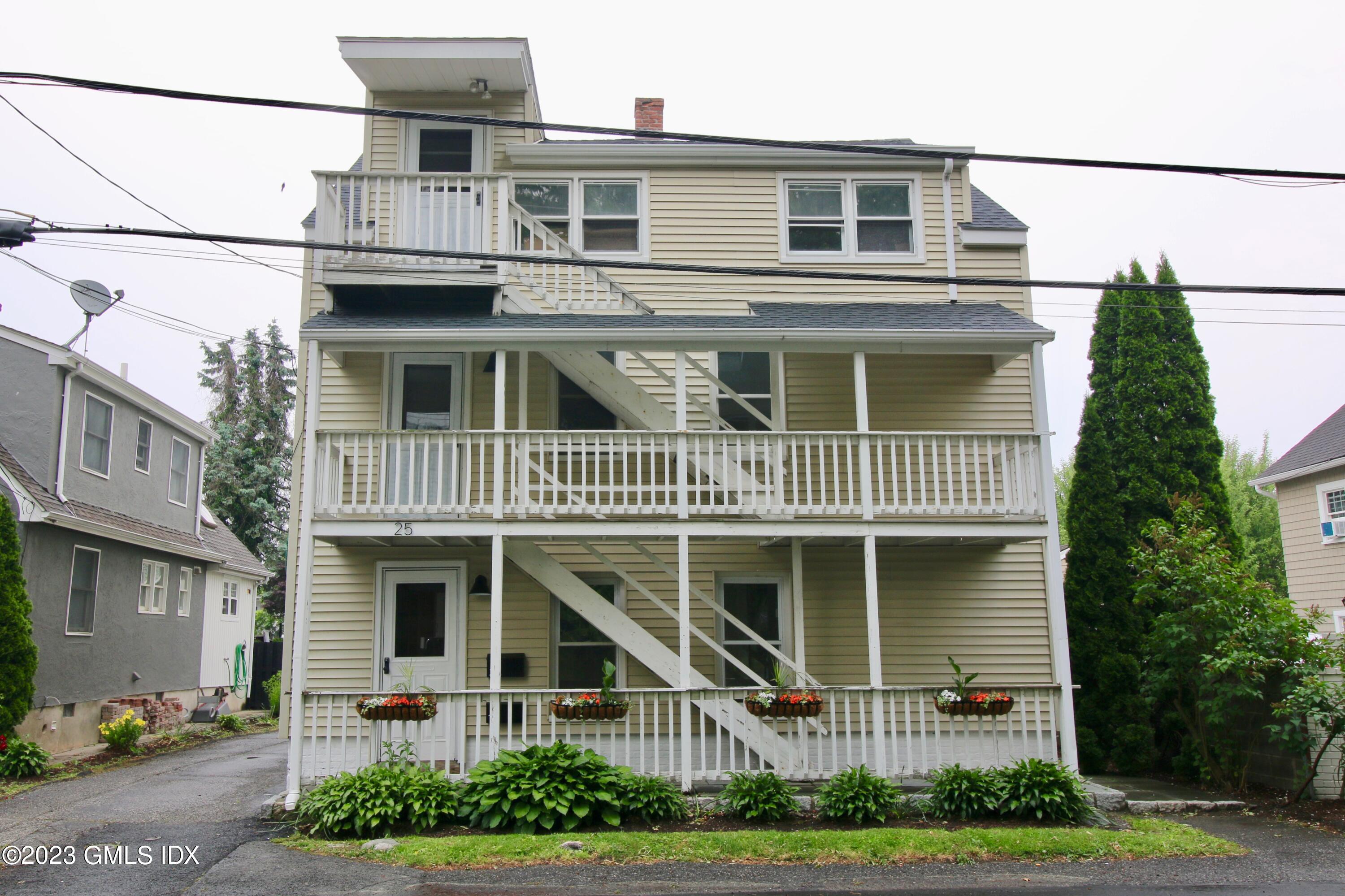 25 Bible Street, Unit 1 Cos Cob, CT 06807 - Photo 1 of 12 a front view of a house