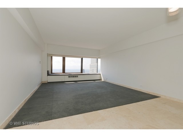175 East Delaware Place, Unit 6001 Chicago, IL 60611 - Photo 5 of 10 a view of an empty room and window